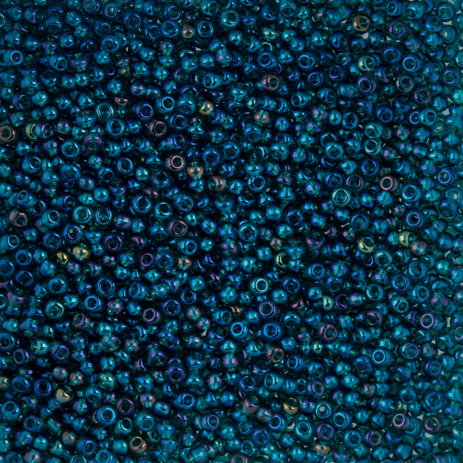 Czech Seed Beads apx. 22g Vial 10/0 Transparent Iris Green (62)